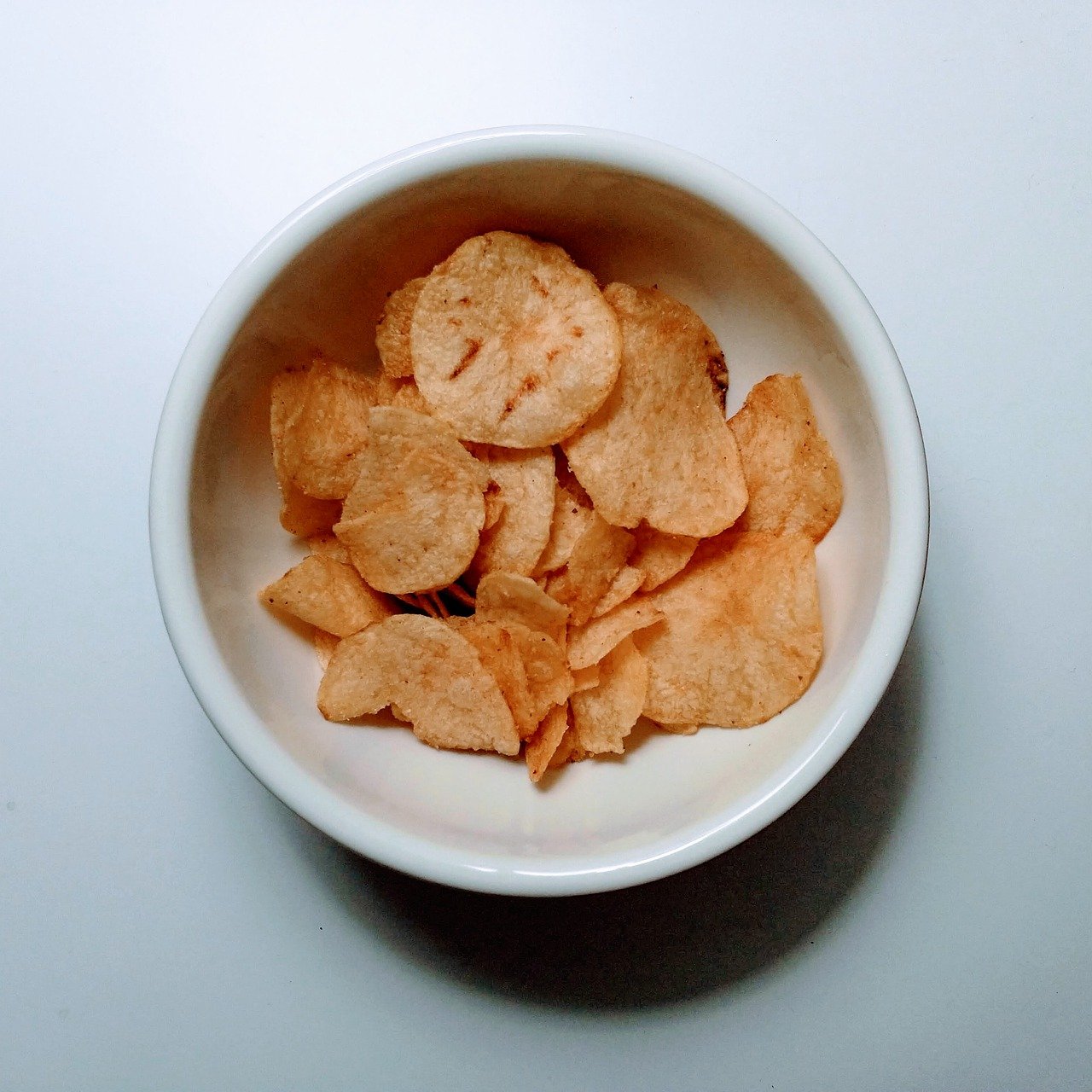 potato chips, bowl, white table-4911645.jpg